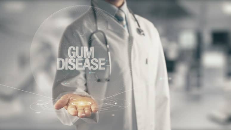 Doctor holding in hand Gum Disease Concept of application new technology in future medicine