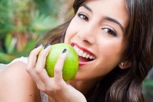Young woman observing dental health and diet