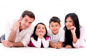 Happy family smiling - isolated over a white background