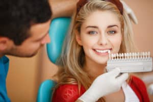 Dentist woman teeth whitening dental clinic