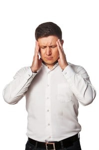 young man with stress needing headache prevention techniques