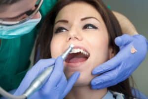 woman receiving dental cleaning