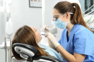 woman receiving dental cleaning