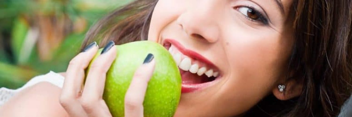 Young woman observing dental health and diet