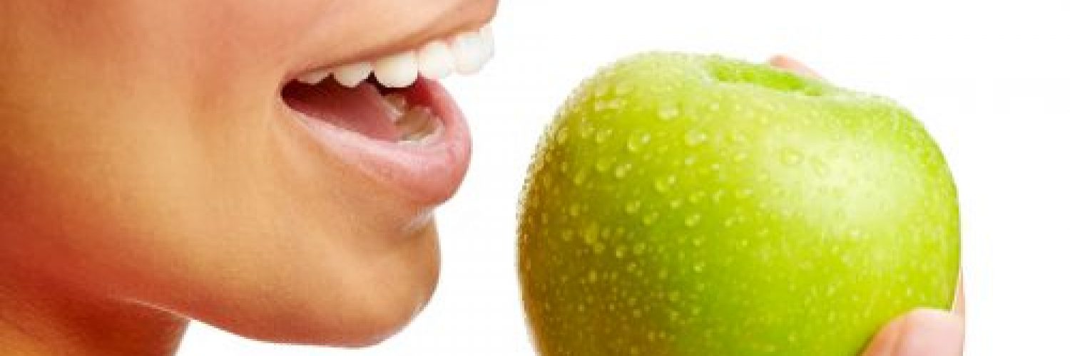 woman eating apple healthy diet and strong teeth