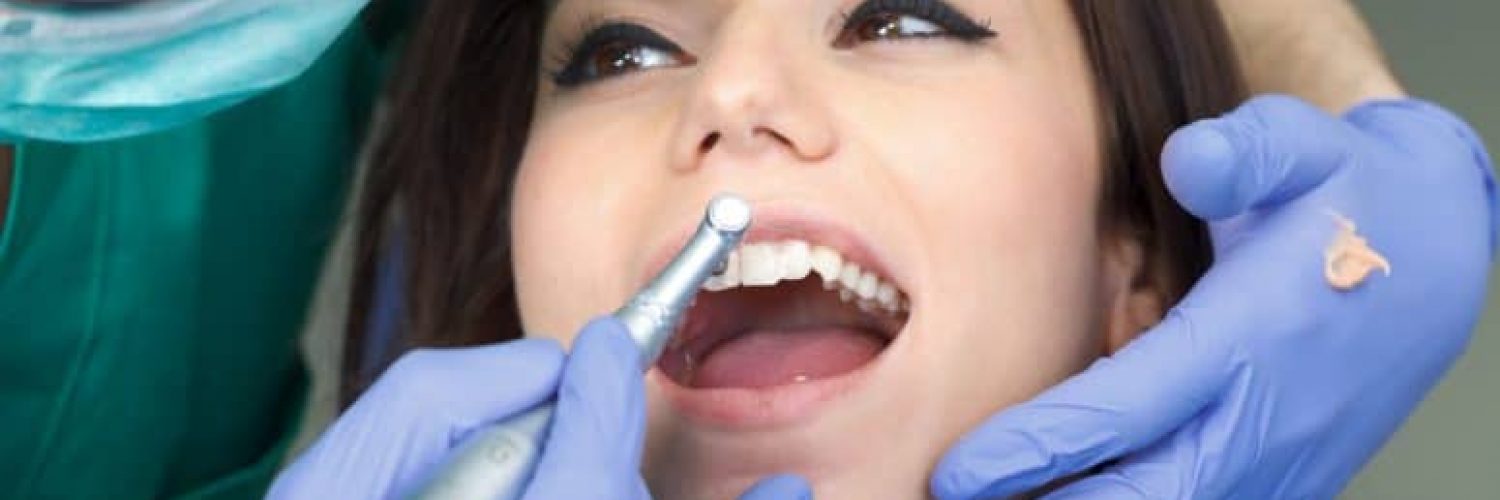 woman receiving dental cleaning