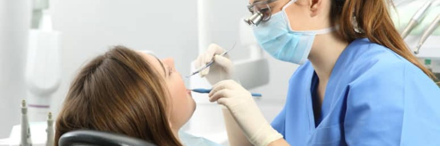 woman receiving dental cleaning