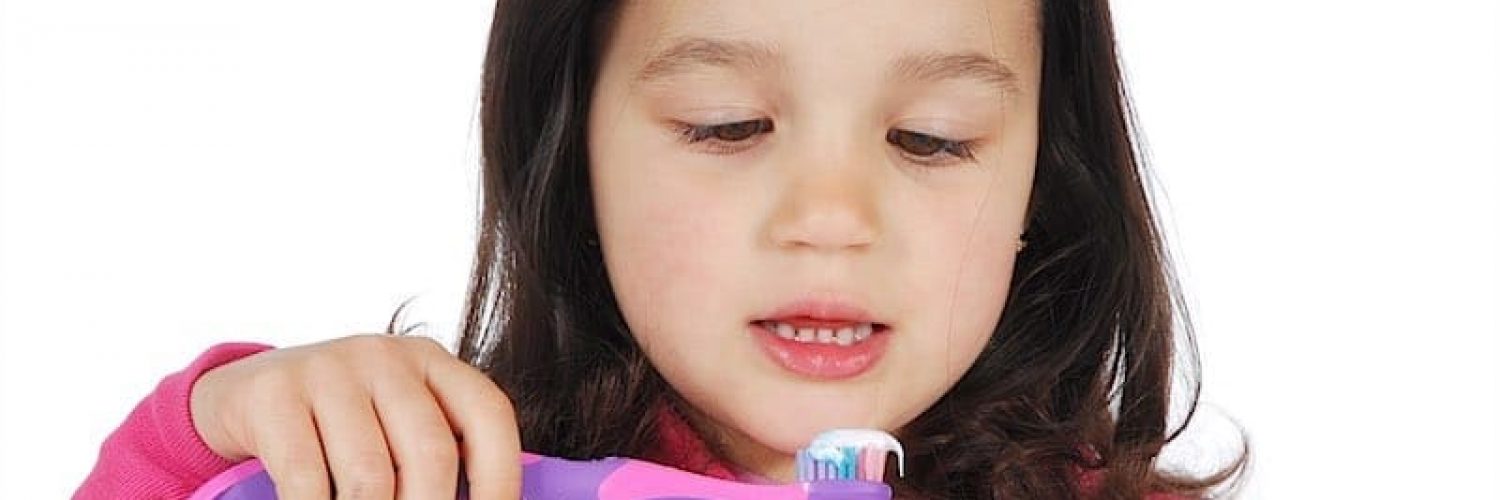 little cute girl brushing the teeth