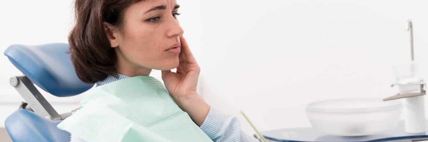 Young Women Suffering Tooth Extraction Complications, idaho falls, local dentist near me, dental