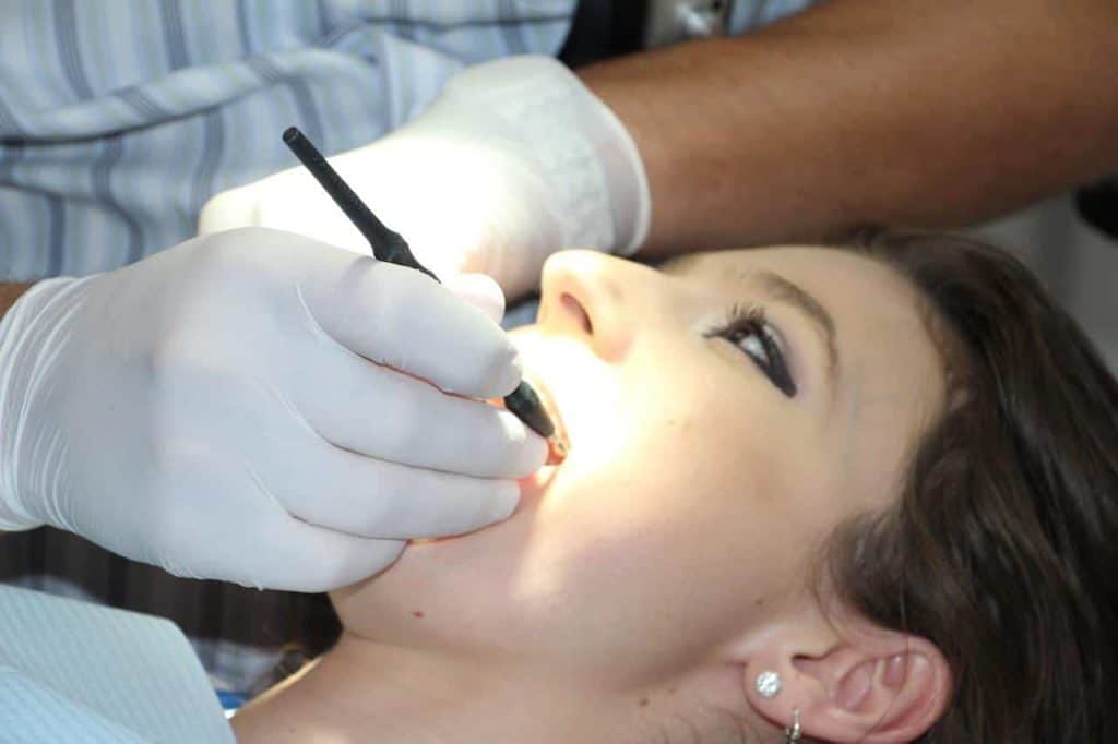 Woman Undergoing Tooth Extraction